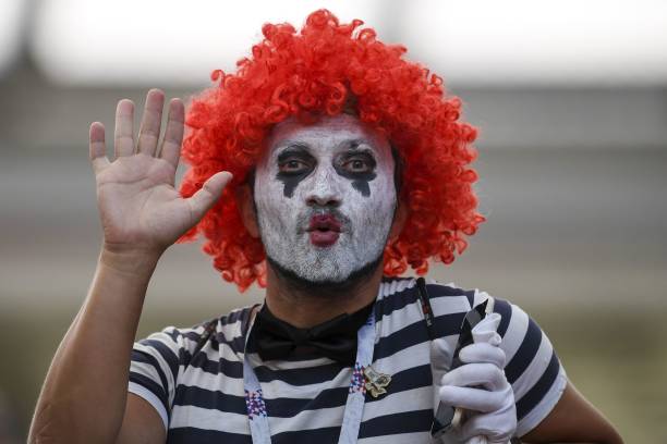 a-fan-dressed-as-a-mime-poses-for-a-picture-during-the-russia-2018-world-cup-group-c-football.jpg