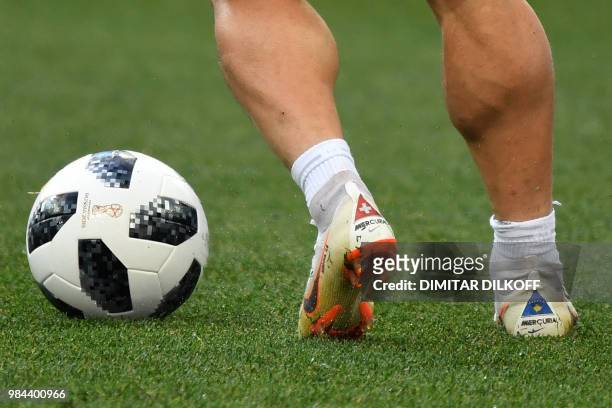 Switzerland's forward Xherdan Shaqiri's football shoes featuring the Swiss and Kosovo flag are pictures as he takes part in a training session at the...