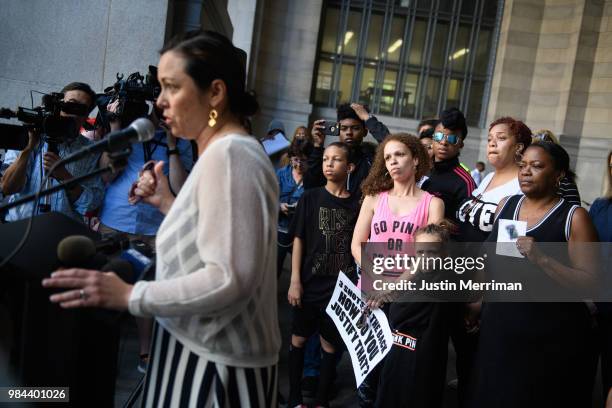 Family members of Antwon Rose II listen to Allegheny County Controller Chelsa Wagner speak during a protest calling for justice for the 17-year-old...