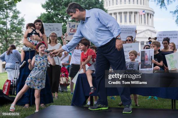 Dr. William Kennedy Smith and his daughter India attend a rally on the East Front lawn of the Capitol to condemn the separation and detention of...