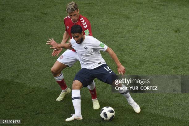 France's midfielder Nabil Fekir is marked by Denmark's defender Jens Stryger Larsen during the Russia 2018 World Cup Group C football match between...