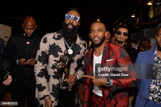 James Harden of the Houston Rockets poses for a photo after winning the Most Valuable Player Award with teammate Chris Paul at the NBA Awards Show on...
