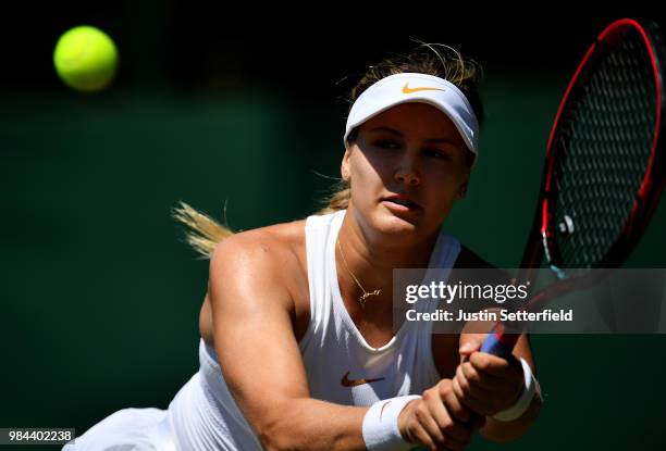 Eugenie Bouchard of Canada plays a backhand against Lin Zhu of China during Wimbledon Championships Qualifying - Day 2 at The Bank of England Sports...