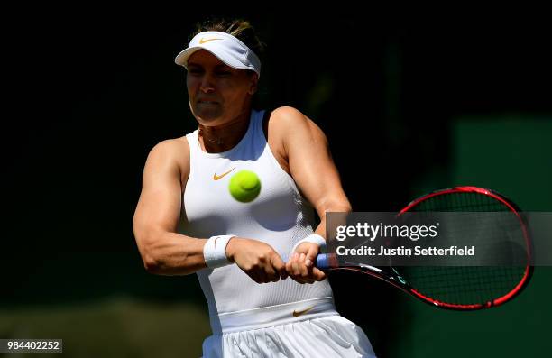 Eugenie Bouchard of Canada plays a backhand against Lin Zhu of China during Wimbledon Championships Qualifying - Day 2 at The Bank of England Sports...