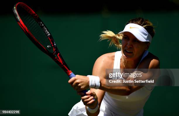 Eugenie Bouchard of Canada plays a backhand against Lin Zhu of China during Wimbledon Championships Qualifying - Day 2 at The Bank of England Sports...