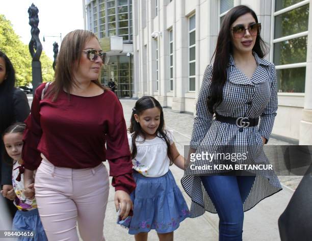 The wife of 'El Chapo', Emma Coronel Aispuro, leaves with her twin daughters from the US Federal Courthouse in Brooklyn after a hearing in the case...