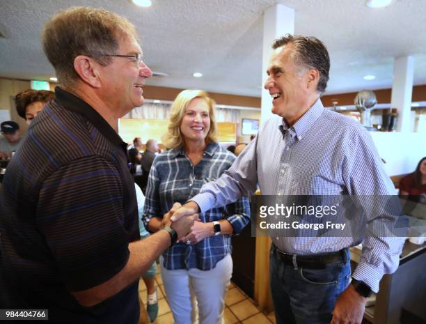 Republican U.S Senate candidate Mitt Romney greets dinners at Sills Cafe for a campaign stop on June 26, 2018 in Layton, Utah. It is primary election...