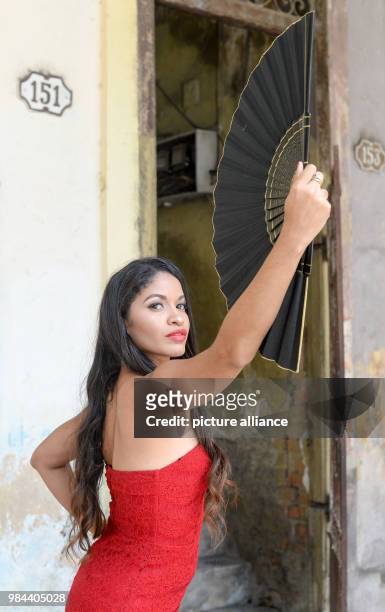 June 2018, Germany, Cuba: Luna Manzanares Nardo standing with a fan in her role as Carmen in the first Cuban musical "Carmen la Cubana" in the...