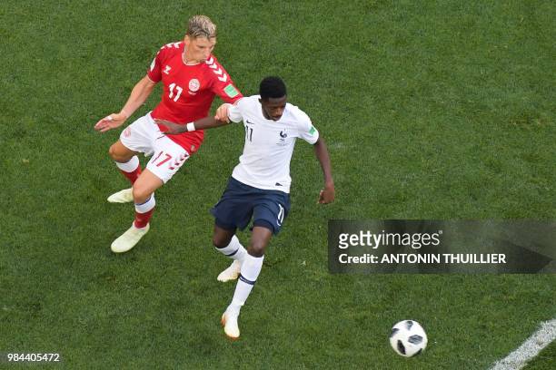 France's forward Ousmane Dembele is marked by Denmark's defender Jens Stryger Larsen during the Russia 2018 World Cup Group C football match between...