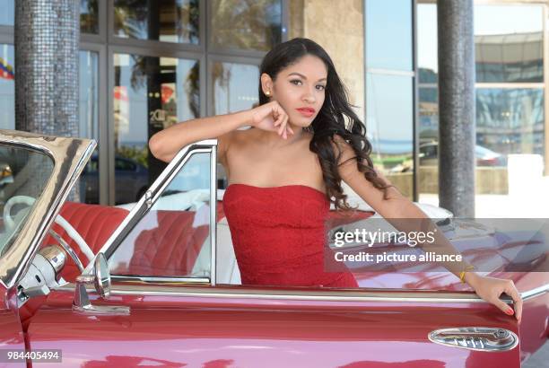 June 2018, Germany, Cuba: Luna Manzanares Nardo posing in her role as Carmen in the first Cuban musical "Carmen la Cubana" in a vintage Cabrio car in...
