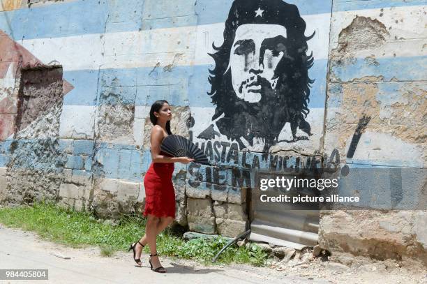 June 2018, Germany, Cuba: Luna Manzanares Nardo standing with a fan in her role as Carmen in the first Cuban musical "Carmen la Cubana" beside a...