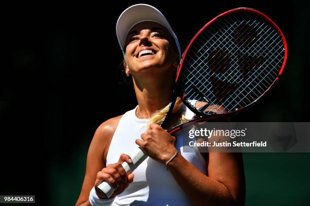 Sabine Lisicki of Germany serves reacts Anna Kalinskaya of Russia during Wimbledon Championships Qualifying - Day 2 at The Bank of England Sports...