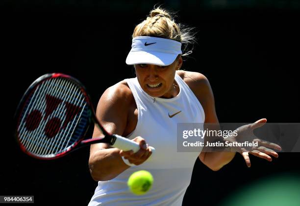 Sabine Lisicki of Germany plays a forehand against Anna Kalinskaya of Russia during Wimbledon Championships Qualifying - Day 2 at The Bank of England...