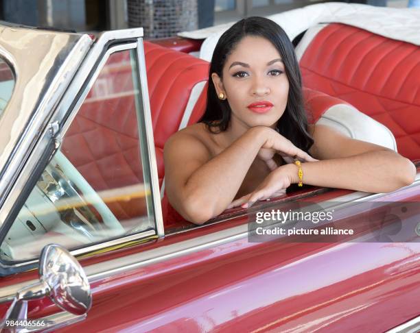 June 2018, Germany, Cuba: Luna Manzanares Nardo posing in her role as Carmen in the first Cuban musical "Carmen la Cubana" in a vintage Cabrio car in...