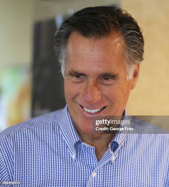 Republican U.S Senate candidate Mitt Romney greets dinners at Sills Cafe for a campaign stop on June 26, 2018 in Layton, Utah. It is primary election...