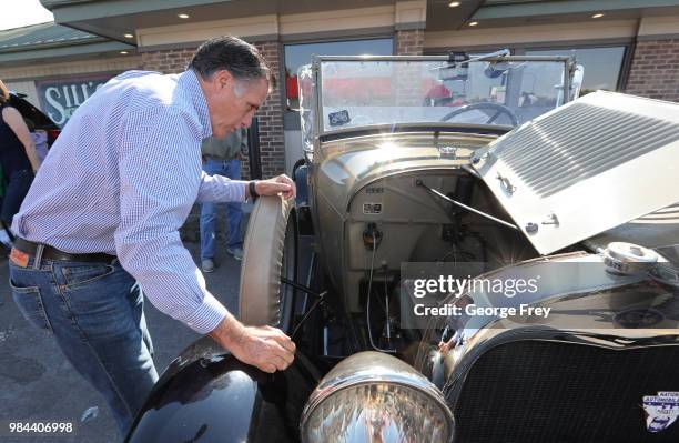 Republican U.S Senate candidate Mitt Romney checks out a 1928 Ford, Model A Roadster at Sills Cafe for a campaign stop on June 26, 2018 in Layton,...