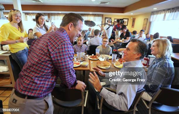 Republican U.S Senate candidate Mitt Romney greets dinners at Sills Cafe for a campaign stop on June 26, 2018 in Layton, Utah. It is primary election...