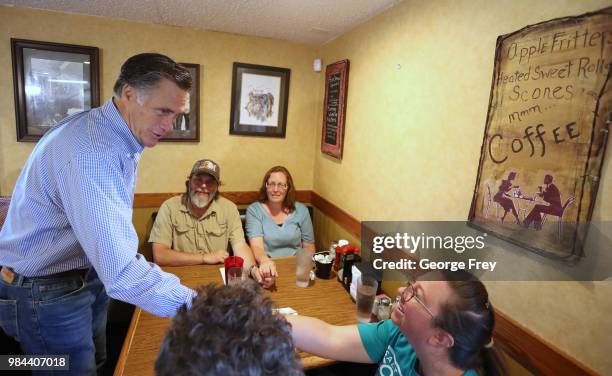 Republican U.S Senate candidate Mitt Romney greets dinners at Sills Cafe for a campaign stop on June 26, 2018 in Layton, Utah. It is primary election...