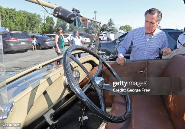 Republican U.S Senate candidate Mitt Romney checks out a 1928 Ford, Model A Roadster at Sills Cafe for a campaign stop on June 26, 2018 in Layton,...