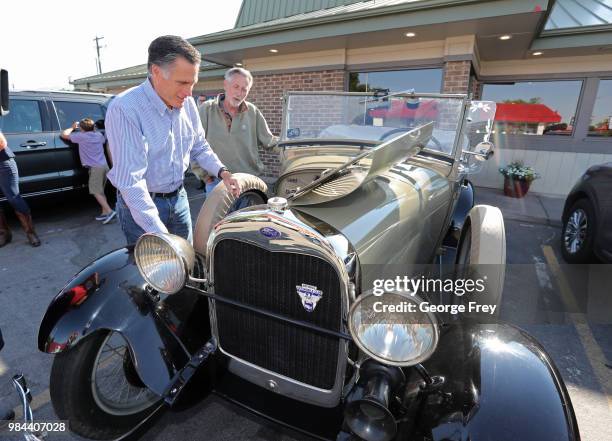 Republican U.S Senate candidate Mitt Romney checks out a 1928 Ford, Model A Roadster at Sills Cafe for a campaign stop on June 26, 2018 in Layton,...