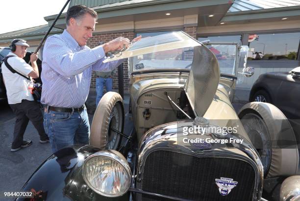 Republican U.S Senate candidate Mitt Romney checks out a 1928 Ford, Model A Roadster at Sills Cafe for a campaign stop on June 26, 2018 in Layton,...
