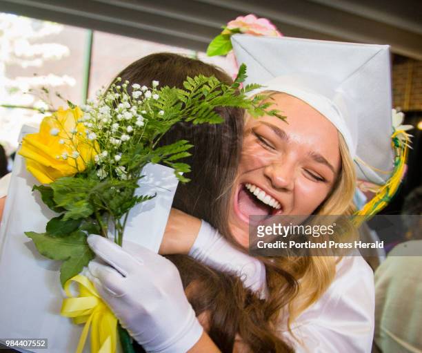 Maine Girls Academy Class President and graduate Sophie Normantas of Biddeford, gives a celabratory hug after the commencement ceremony at the...