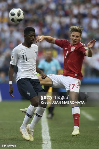 France's forward Ousmane Dembele vies with Denmark's defender Jens Stryger Larsen during the Russia 2018 World Cup Group C football match between...