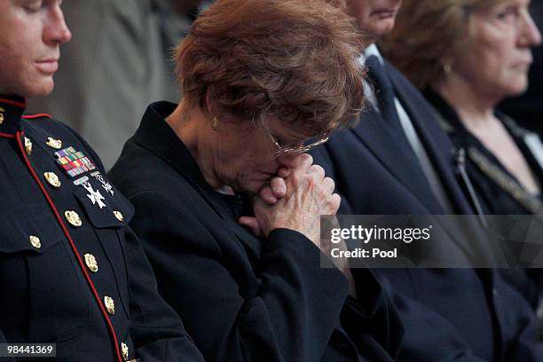 Family members grieve during the funeral service for LAPD SWAT officer Robert James Cottle at the Cathedral of Our Lady of The Angels on April 13,...