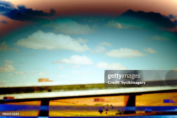 abstract scene, guard rail, clouds in sky - remote guarding stock pictures, royalty-free photos & images