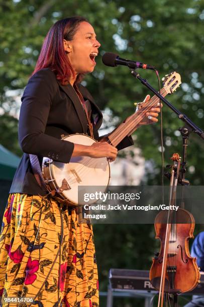 American folk and country singer and multi-instrumentalist Rhiannon Giddens performs on banjo with her band at Central Park SummerStage, New York,...