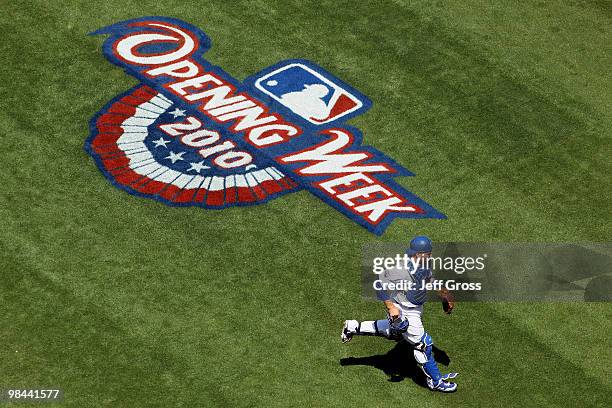 Catcher Russell Martin of the Los Angeles Dodgers runs out to home plate to start the home opener game against the Arizona Diamondbacks at Dodger...