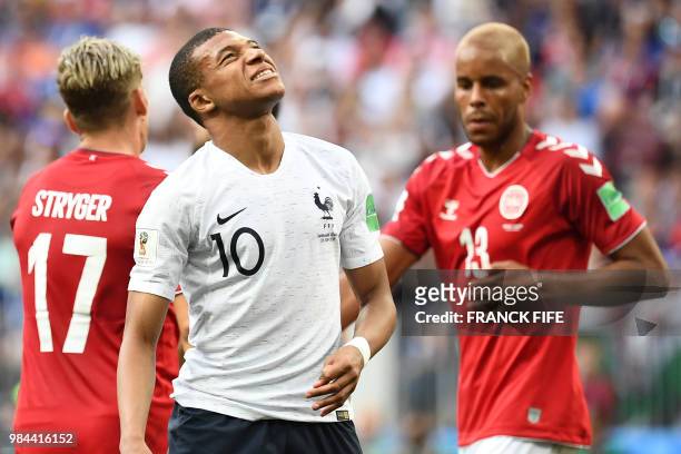 France's forward Kylian Mbappe looks upwards during the Russia 2018 World Cup Group C football match between Denmark and France at the Luzhniki...