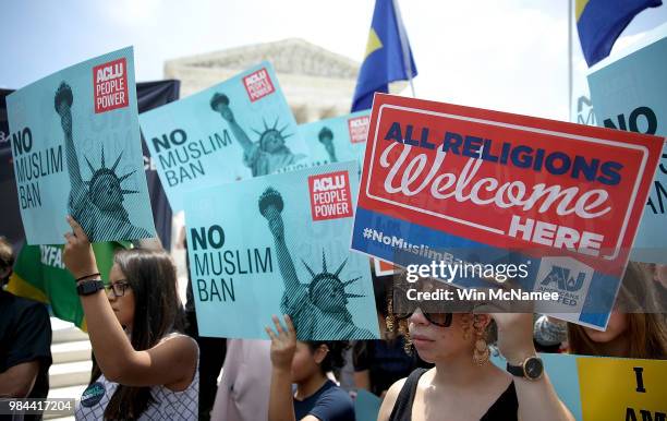 Protesters gather outside the U.S. Supreme Court as the court issued an immigration ruling June 26, 2018 in Washington, DC. The court issued a 5-4...
