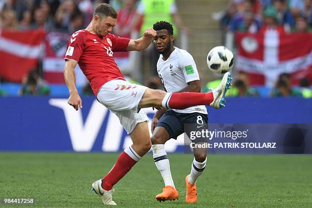 Denmark's defender Henrik Dalsgaard kicks the ball past France's forward Thomas Lemar during the Russia 2018 World Cup Group C football match between...