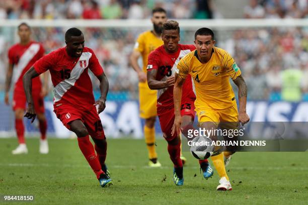 Australia's forward Tim Cahill vies for the ball with Peru's midfielder Pedro Aquino and Peru's defender Christian Ramos during the Russia 2018 World...