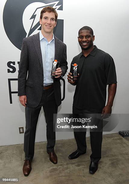 Football players Eli Manning of the New York Giants and LaDainian Tomlinson of the New York Jets attend the launch of G Series Pro by Gatorade at 40...