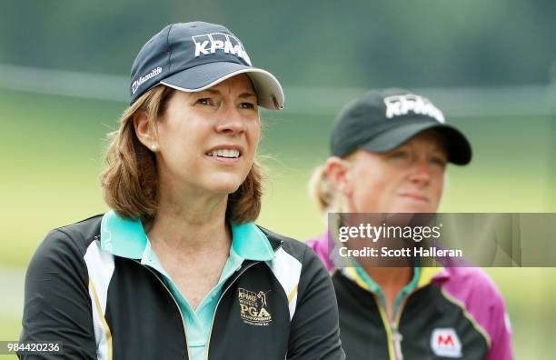 Lynne Doughtie, Chairman and CEO of KPMG, waits on a tee alongside Stacy Lewis during the pro-am prior to the start of the KPMG Women's PGA...