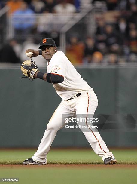 Juan Uribe of the San Francisco Giants throws the ball to first base during their game against the Pittsburgh Pirates at AT&T Park on April 12, 2010...