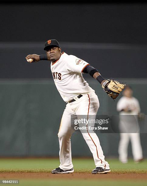 Juan Uribe of the San Francisco Giants throws the ball to first base during their game against the Pittsburgh Pirates at AT&T Park on April 12, 2010...