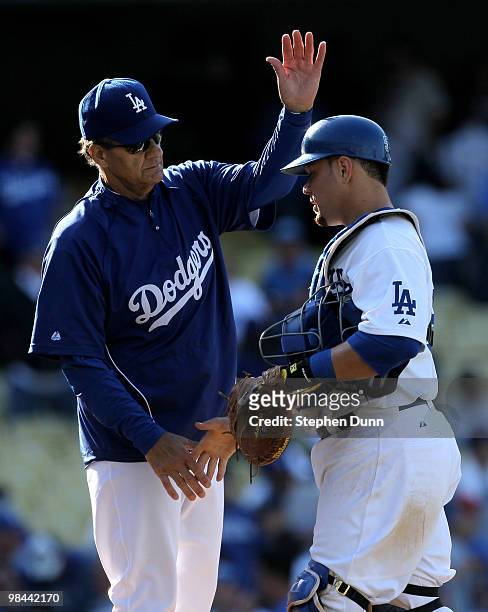 Manager Joe Torre of the Los Angeles Dodgers greets catcher Russell Martin after the game with the Arizona Diamondbacks on April 13, 2010 at Dodger...