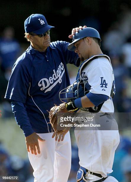 Manager Joe Torre of the Los Angeles Dodgers greets catcher Russell Martin after the game with the Arizona Diamondbacks on April 13, 2010 at Dodger...