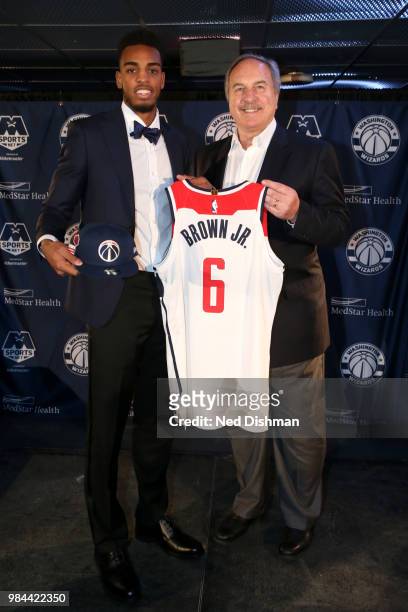 Washington Wizards first-round draft pick Troy Brown Jr. Poses for a photo with Ernie Grunfeld during a press conference on June 25, 2018 at Capital...