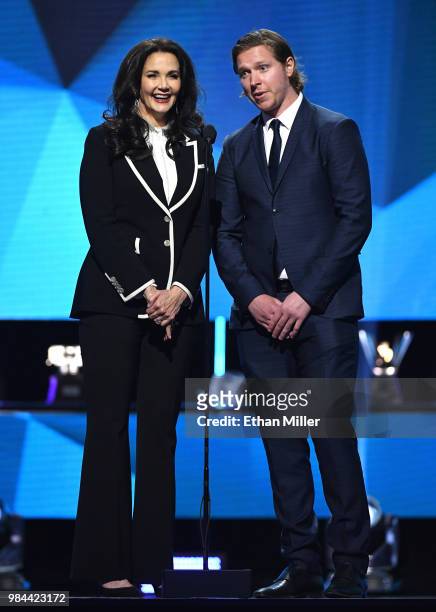 Actress Lynda Carter and Nicklas Backstrom of the Washington Capitals present the NHL General Manager of the Year Award during the 2018 NHL Awards...