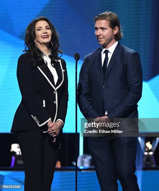 Actress Lynda Carter and Nicklas Backstrom of the Washington Capitals present the NHL General Manager of the Year Award during the 2018 NHL Awards...
