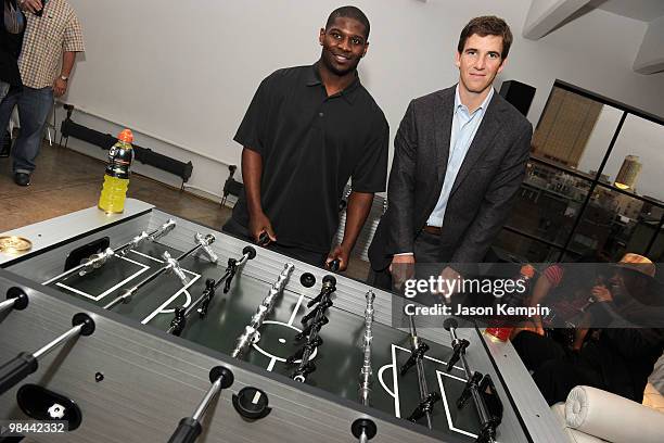 Football players LaDainian Tomlinson of the New York Jets and Eli Manning of the New York Giants attend the launch of G Series Pro by Gatorade at 40...