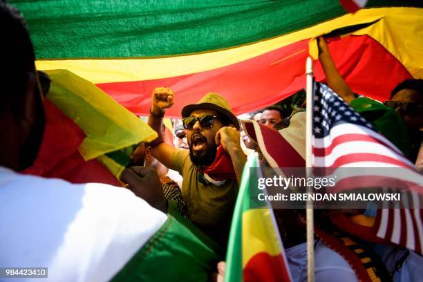 Supporters of Ethiopia's Prime Minister Abiy Ahmed rally for US support outside the State Department on June 26, 2018 in Washington, DC.