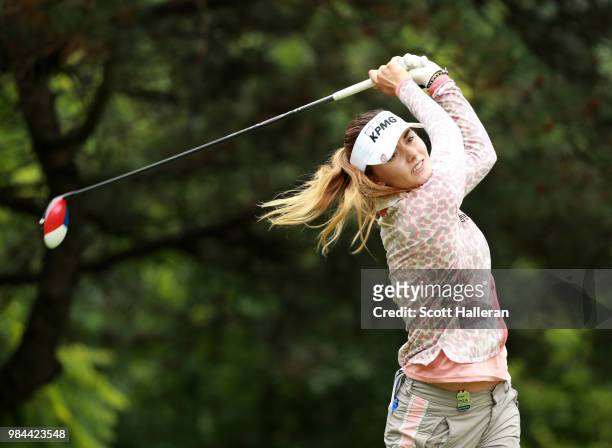 Klara Spilkova of the Czech Republic watches a tee shot during the pro-am prior to the start of the KPMG Women's PGA Championship at Kemper Lakes...