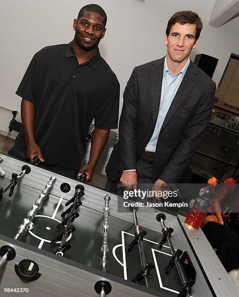 Football players LaDainian Tomlinson of the New York Jets and Eli Manning of the New York Giants attend the launch of G Series Pro by Gatorade at 40...