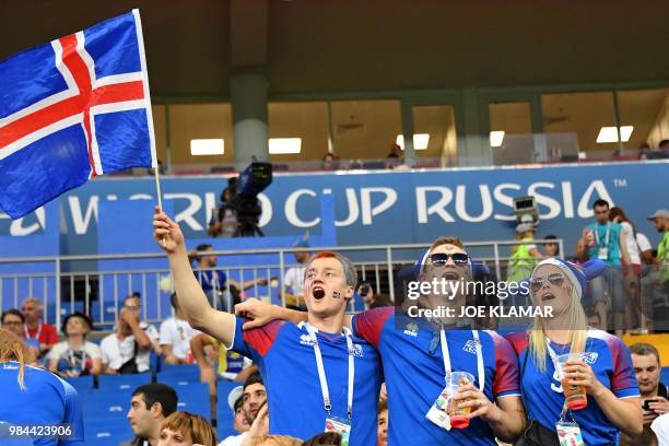 Iceland's supporters pose ahead of the Russia 2018 World Cup Group D football match between Iceland and Croatia at the Rostov Arena in Rostov-On-Don...
