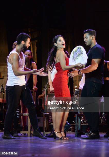 June 2018, Germany, Cuba: Luna Manzanares Nardo as Carmen and the ensemble performing onstage at the first Cuban musical "Carmen la Cubana" at the...